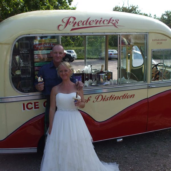 The bride and groom on the gallery of Sussex Vintage Ices